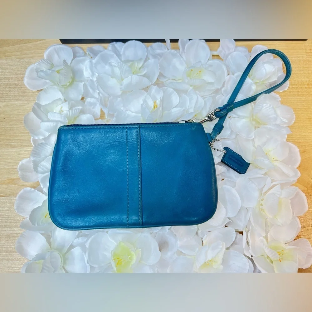 Coach Legacy Leather Small Wristlet. design is  featured during Coach’s 65th